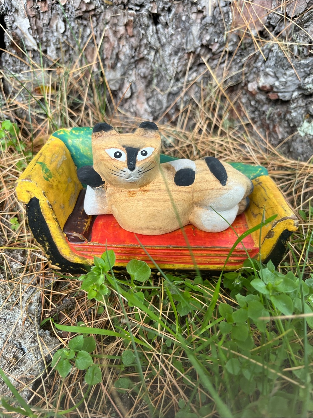 Hand-Painted Cat Figurine on Colorful Sofa